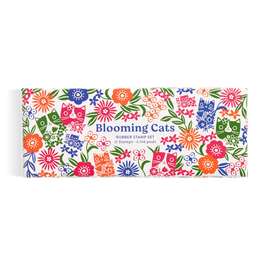 The Tara Lilly Blooming Cats Rubber Stamp Set features playful cat and floral motifs in red, blue, orange, green, and purple on a crisp white box.