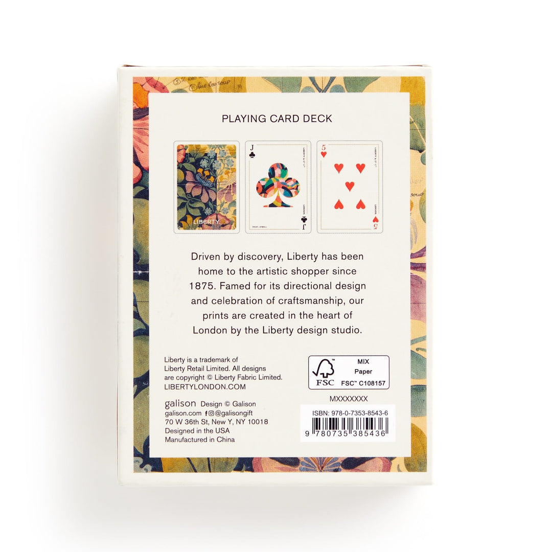 The back of the Liberty Archive Playing Card Deck by Liberty London displays floral patterns from Liberty’s textile heritage, two card face previews, design history text, a barcode, FSC certification, and manufacturer info at the bottom.