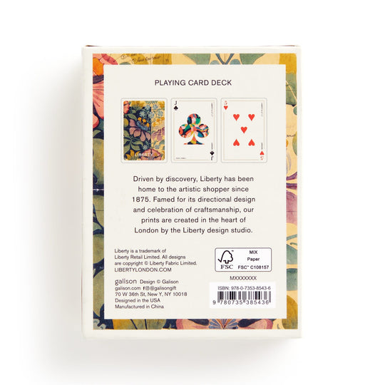 The back of the Liberty Archive Playing Card Deck by Liberty London displays floral patterns from Liberty’s textile heritage, two card face previews, design history text, a barcode, FSC certification, and manufacturer info at the bottom.