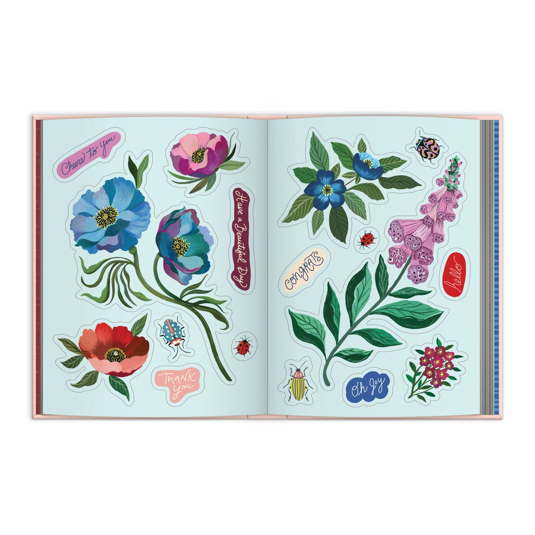 The Art of the Forest 100 Page Sticker Book by Christine De Carvalho features vibrant wildlife stickers—flowers, leaves, ladybugs, insects—and phrases like “Thank you,” “Congrats,” and “Oh yay!” on a light blue forest-inspired background.