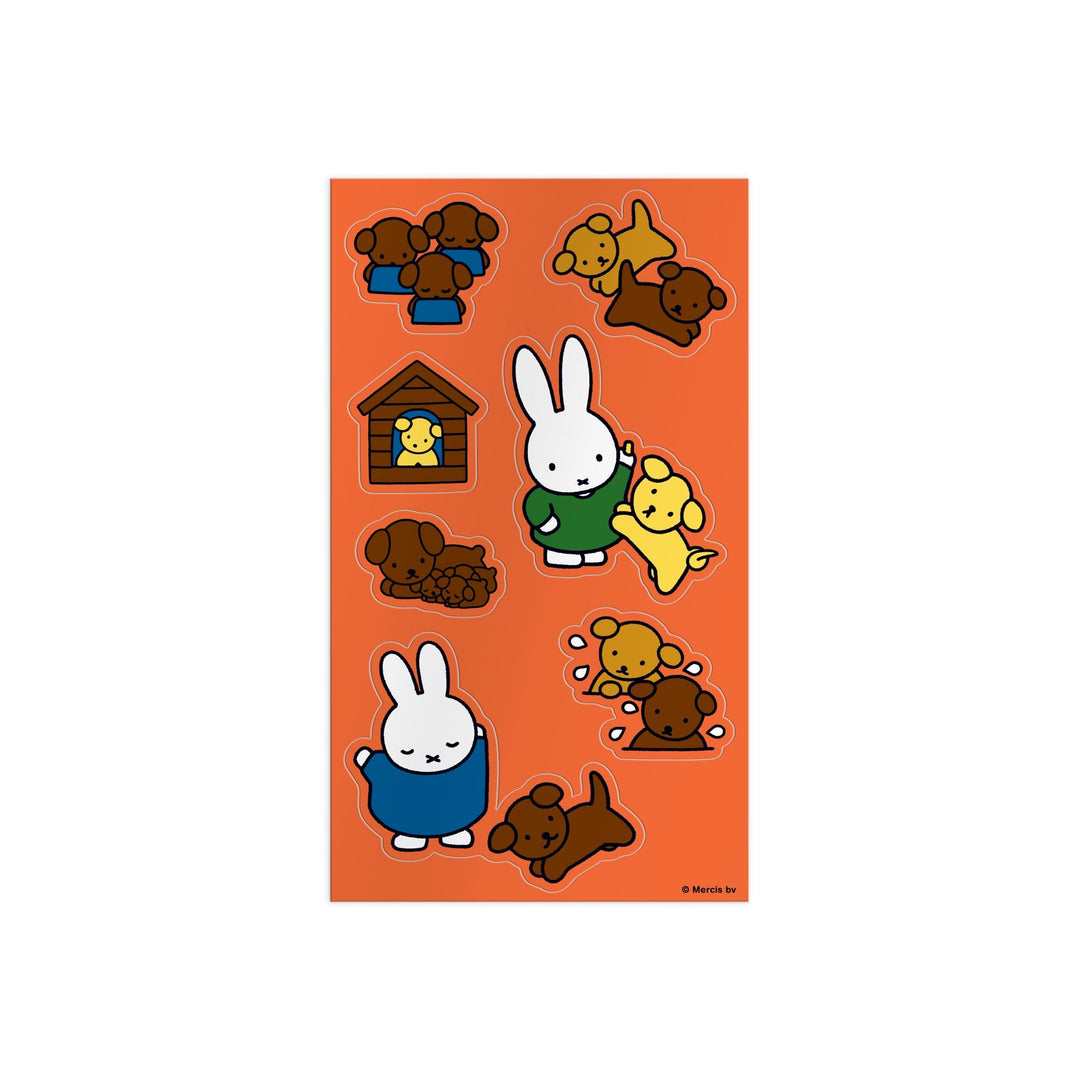 The Miffy Sticker Tin by Miffy features a sheet with cartoon bunny, yellow dog, brown dog, and a yellow bird in a doghouse on an orange background. The animals are playing, cuddling, and resting together.