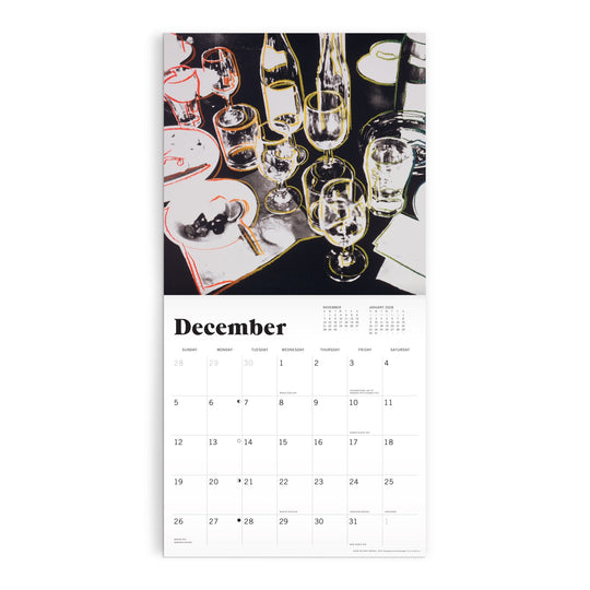 The Andy Warhol Foundation For The Visual Arts 12 x 12 Wall Calendar 2027 features December’s page with artwork of a dinner table set with glasses, bottles, plates, utensils, the month’s days below, and a yearly overview at the top.