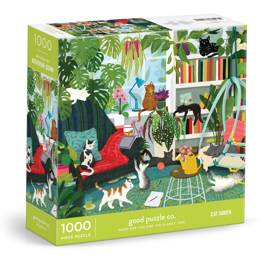 The Good Puzzle Co. Cat Haven 1000 Piece Puzzle by Katherine Quinn features an illustrated cozy room with playful cats, plants, and books, all packaged using recycled materials.