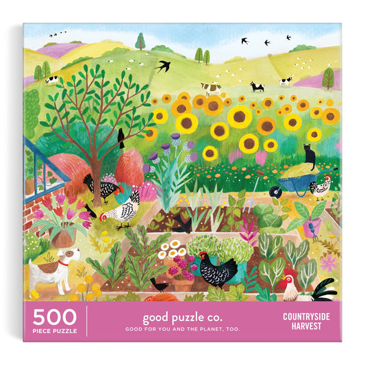 The Bex Parkin Good Puzzle Co. Countryside Harvest 500pc Puzzle features a vibrant garden with sunflowers, chickens, a dog, and lush plants. Made with recycled materials and nontoxic inks.