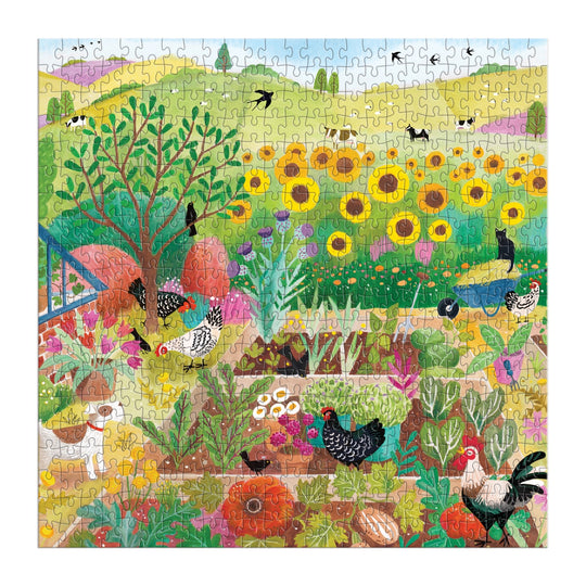 The Good Puzzle Co. Countryside Harvest 500pc Puzzle by Bex Parkin features a vibrant garden scene with chickens, pumpkins, sunflowers, and rolling hills—made from recycled materials and printed with nontoxic inks.