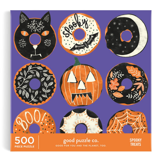 The Good Puzzle Co. Spooky Treats 500pc Puzzle by Laura Watkins features nine Halloween-themed donuts on a purple background, crafted from recycled materials for festive and sustainable fun.
