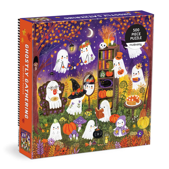 The Jenny Miriam Ghostly Gathering 500 Piece Puzzle features cute ghosts celebrating in a pumpkin-filled autumn garden under a starry sky—perfect for family fun and cozy nights in.