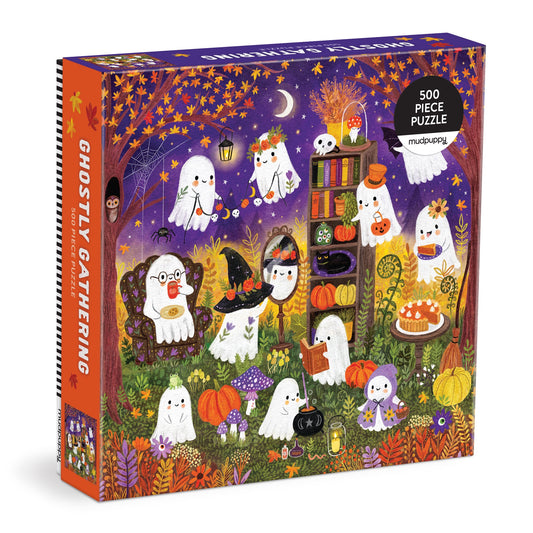 The Jenny Miriam Ghostly Gathering 500 Piece Puzzle features cute ghosts celebrating in a pumpkin-filled autumn garden under a starry sky—perfect for family fun and cozy nights in.