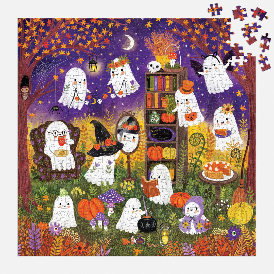 The Ghostly Gathering 500 Piece Puzzle by Jenny Miriam features adorable ghosts enjoying a nighttime Halloween tea party with pumpkins, autumn leaves, books, and treats under a starry sky. Several pieces are missing from the top right corner.