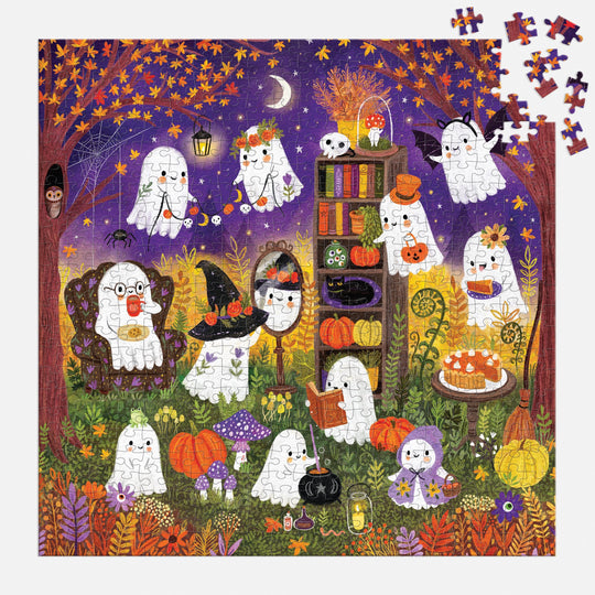 The Ghostly Gathering 500 Piece Puzzle by Jenny Miriam features adorable ghosts enjoying a nighttime Halloween tea party with pumpkins, autumn leaves, books, and treats under a starry sky. Several pieces are missing from the top right corner.