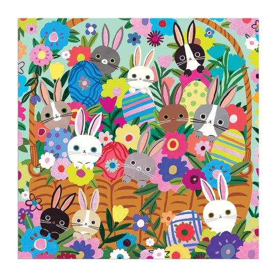 A vibrant illustration inspired by Tara Lilly's Blooming Bunnies 500 Piece Foil Family Puzzle, featuring cute bunnies with different fur colors in and around a large wicker basket amidst bright flowers and decorated Easter eggs.