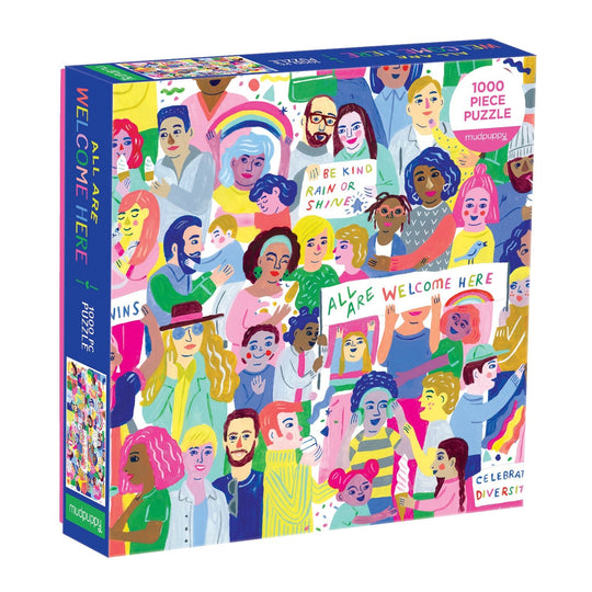 The All Are Welcome Here! 1000 Piece Family Puzzle by Sarah Walsh features diverse illustrated people holding positive signs like “BE KIND” and “WELCOME HERE.” The box reads “ALL ARE WELCOME HERE” and “CELEBRATE DIVERSITY.”.